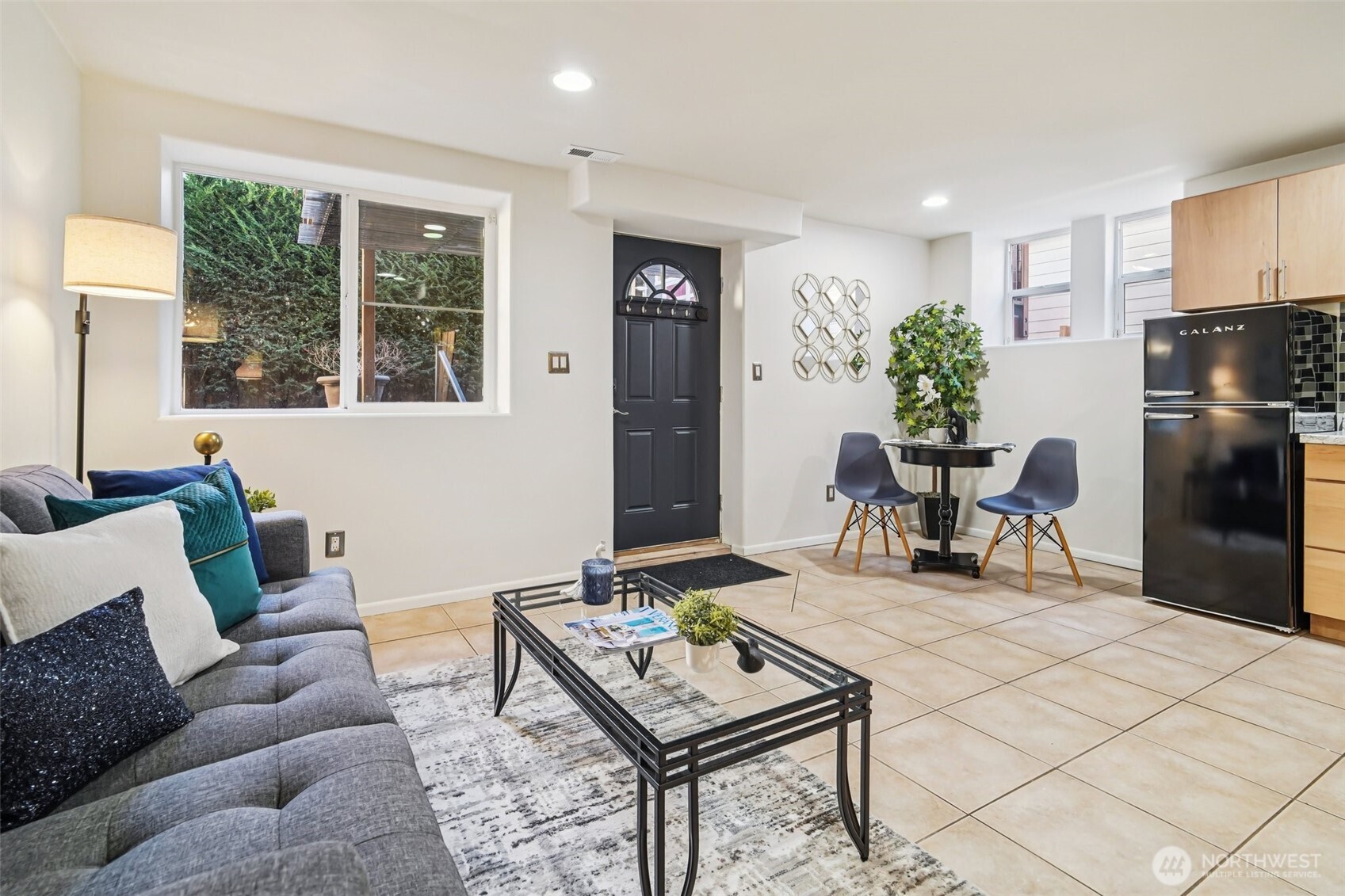 534 25th Avenue South Seattle, WA 98144 - Photo 24 of 35 a living room with furniture and a dining table with kitchen view