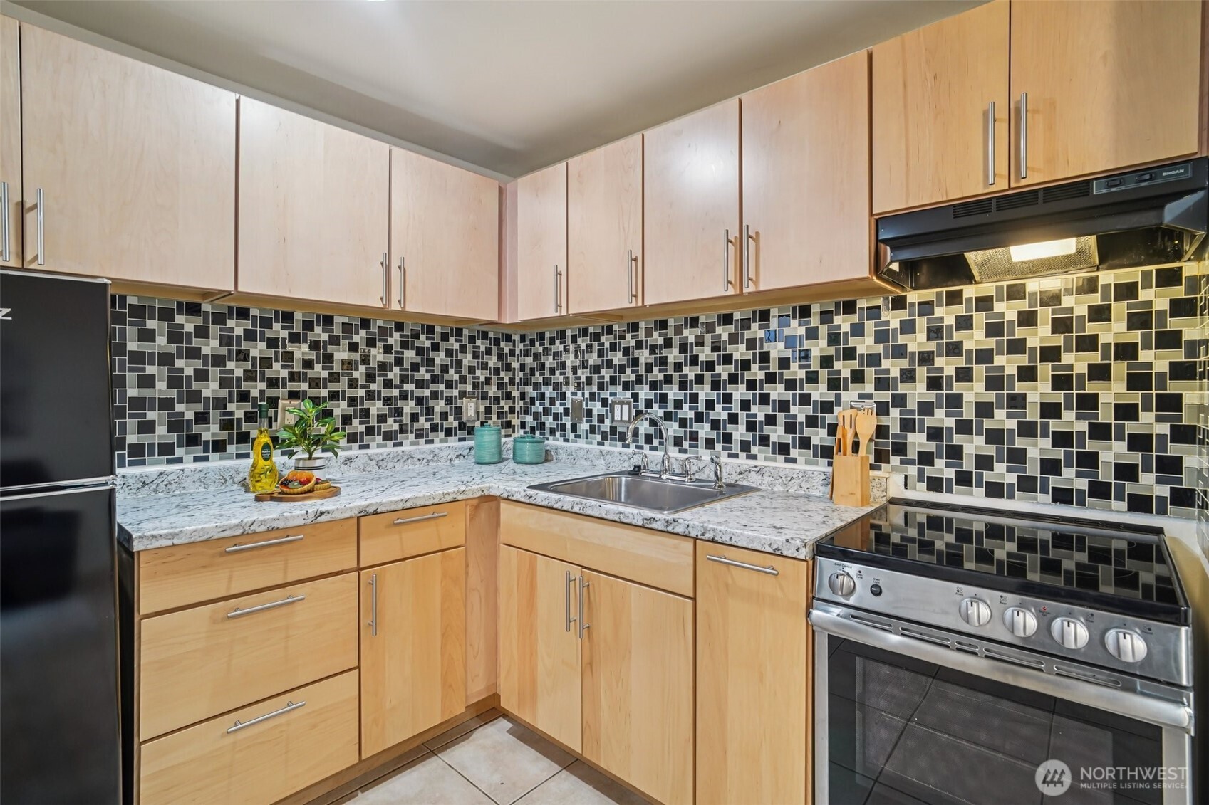534 25th Avenue South Seattle, WA 98144 - Photo 28 of 35 a kitchen with a sink a stove and cabinets