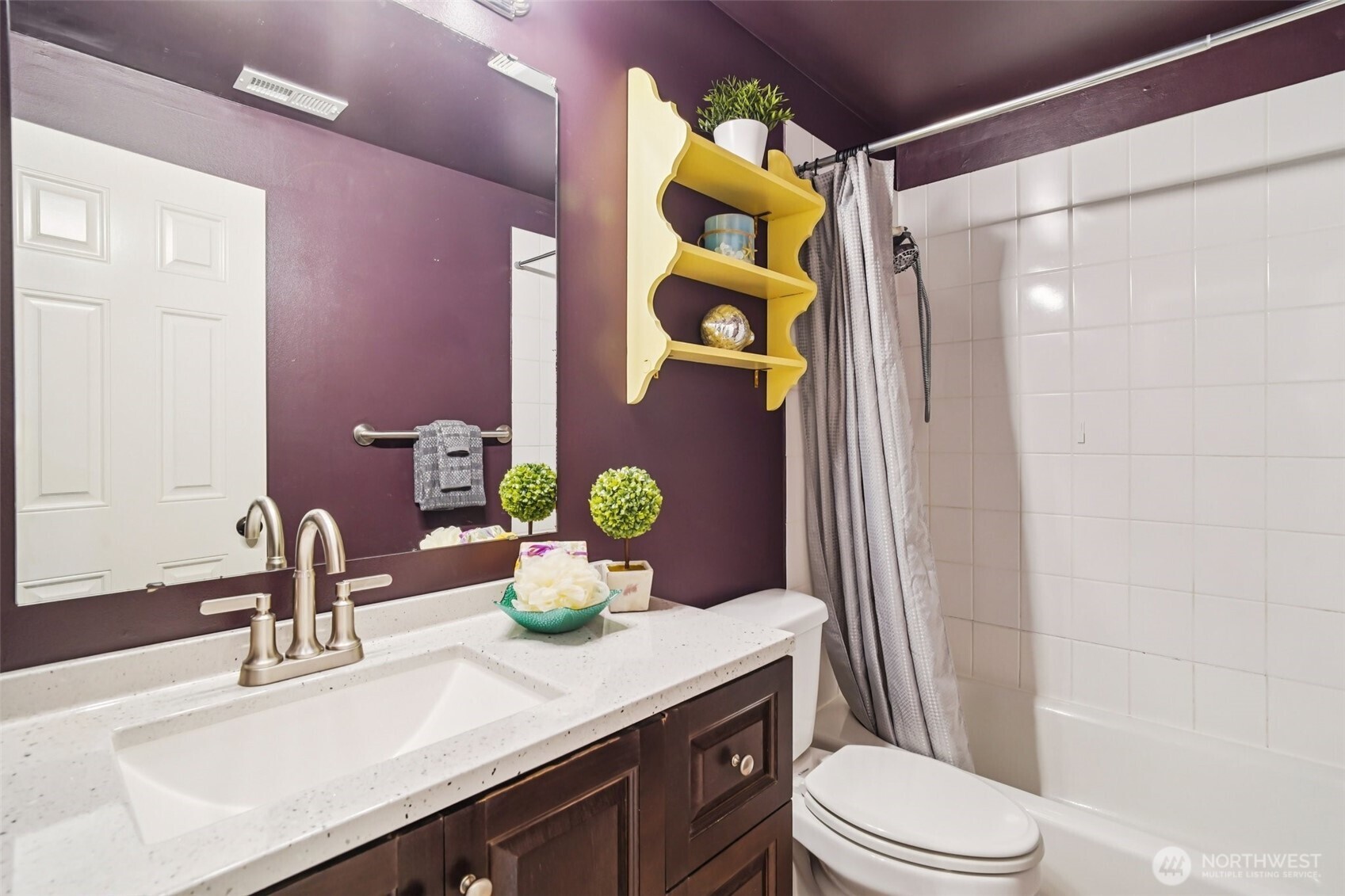 534 25th Avenue South Seattle, WA 98144 - Photo 29 of 35 a bathroom with a sink a toilet and shower curtain