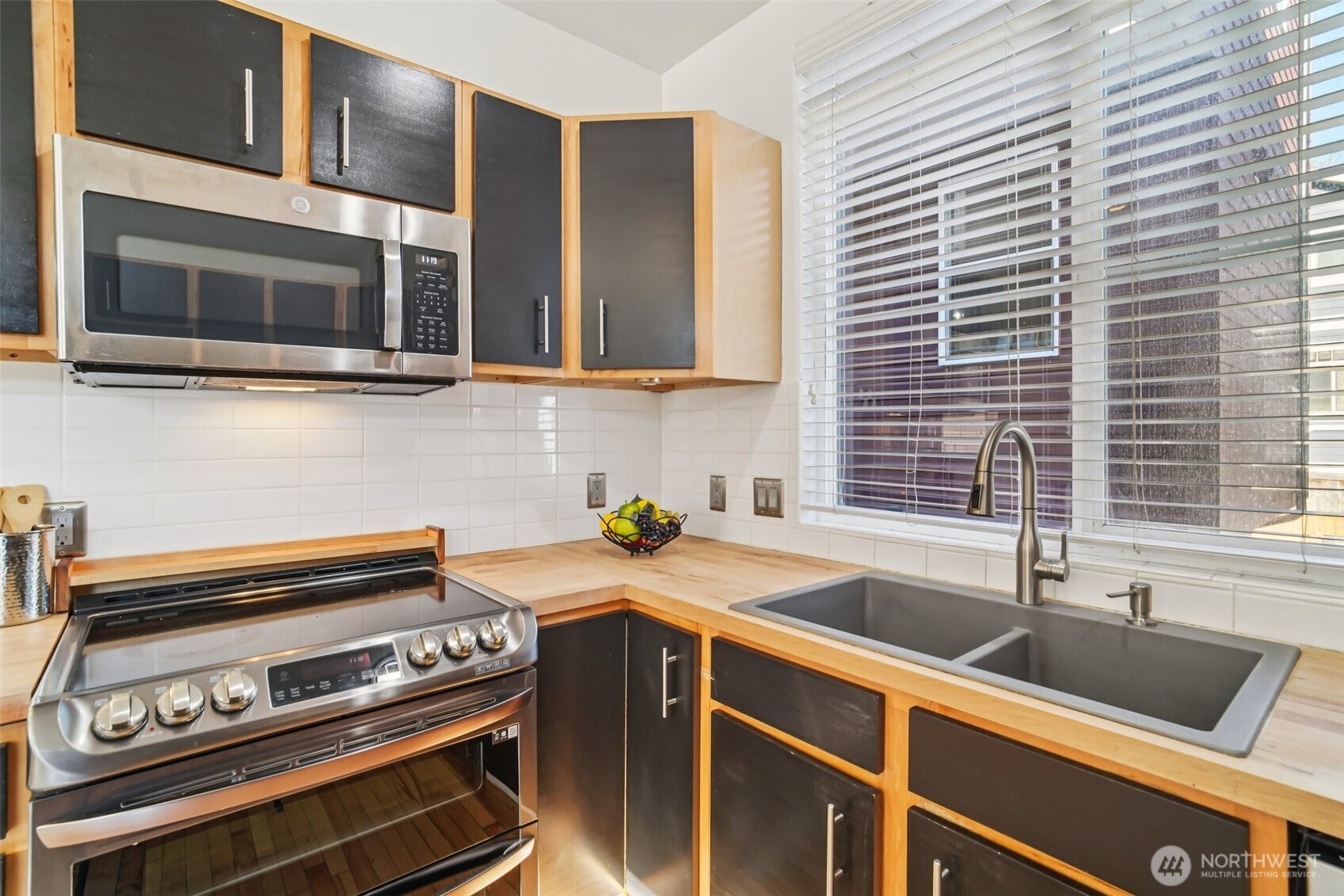 534 25th Avenue South Seattle, WA 98144 - Photo 8 of 35 a kitchen with a stove and a sink
