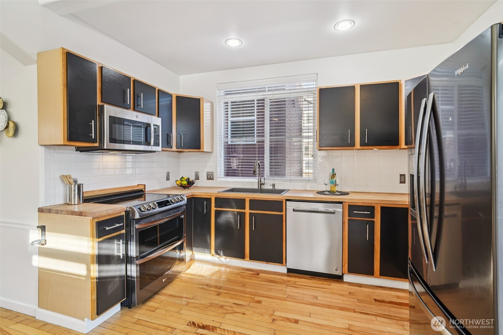 534 25th Avenue South Seattle, WA 98144 - Photo 9 of 35 a kitchen with stainless steel appliances granite countertop a stove and a refrigerator