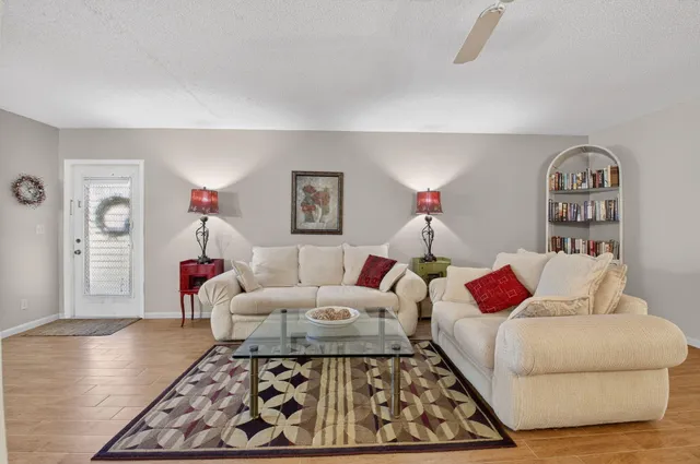 a living room with furniture and a rug