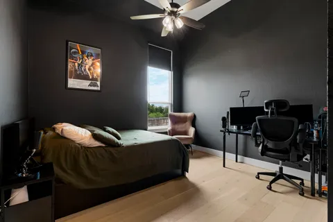 a bedroom with furniture and a window