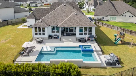 a view of a house with swimming pool