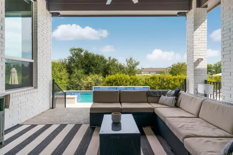 a view of balcony with furniture