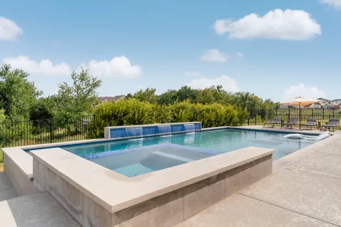 a view of swimming pool with lounge chair