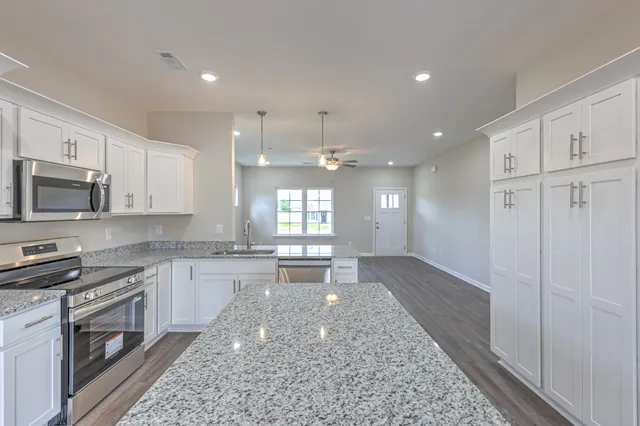 a view of an entryway with wooden floor