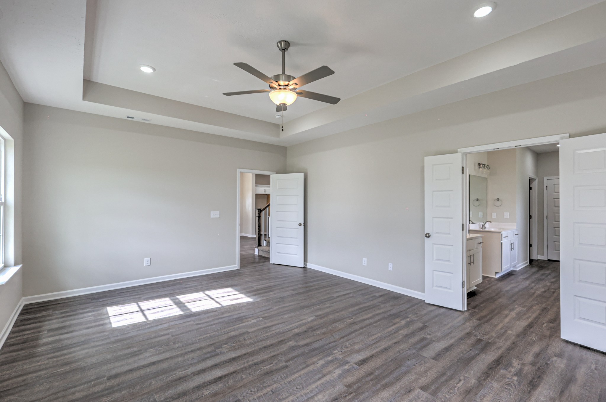 22 Bartow Street Decherd, TN 37324 - Photo 17 of 38 a view of empty room with wooden floor and fan