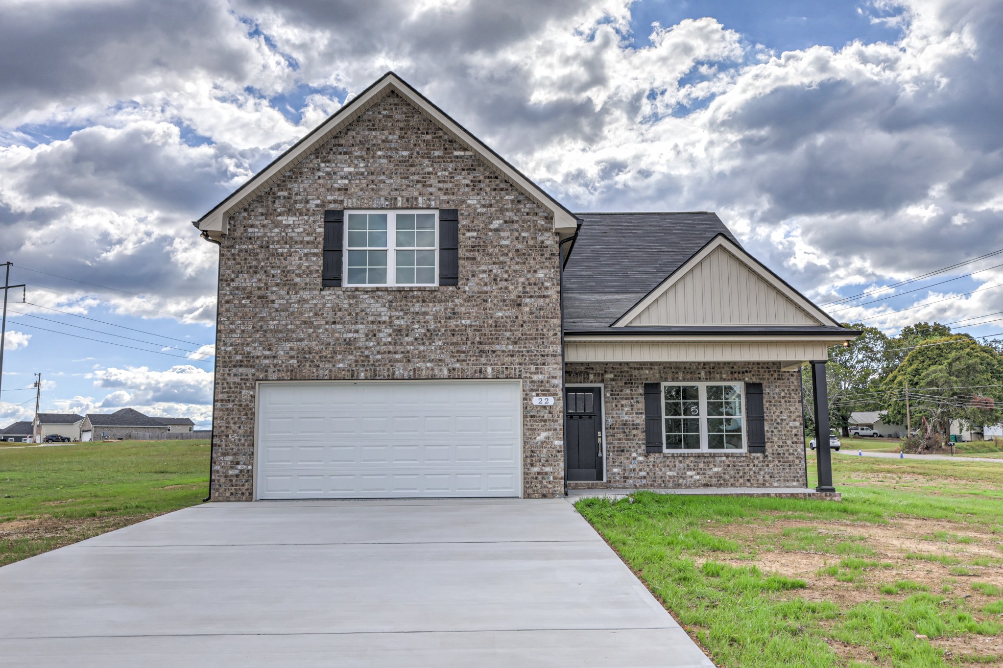 22 Bartow Street Decherd, TN 37324 - Photo 2 of 38 a front view of a house with garden