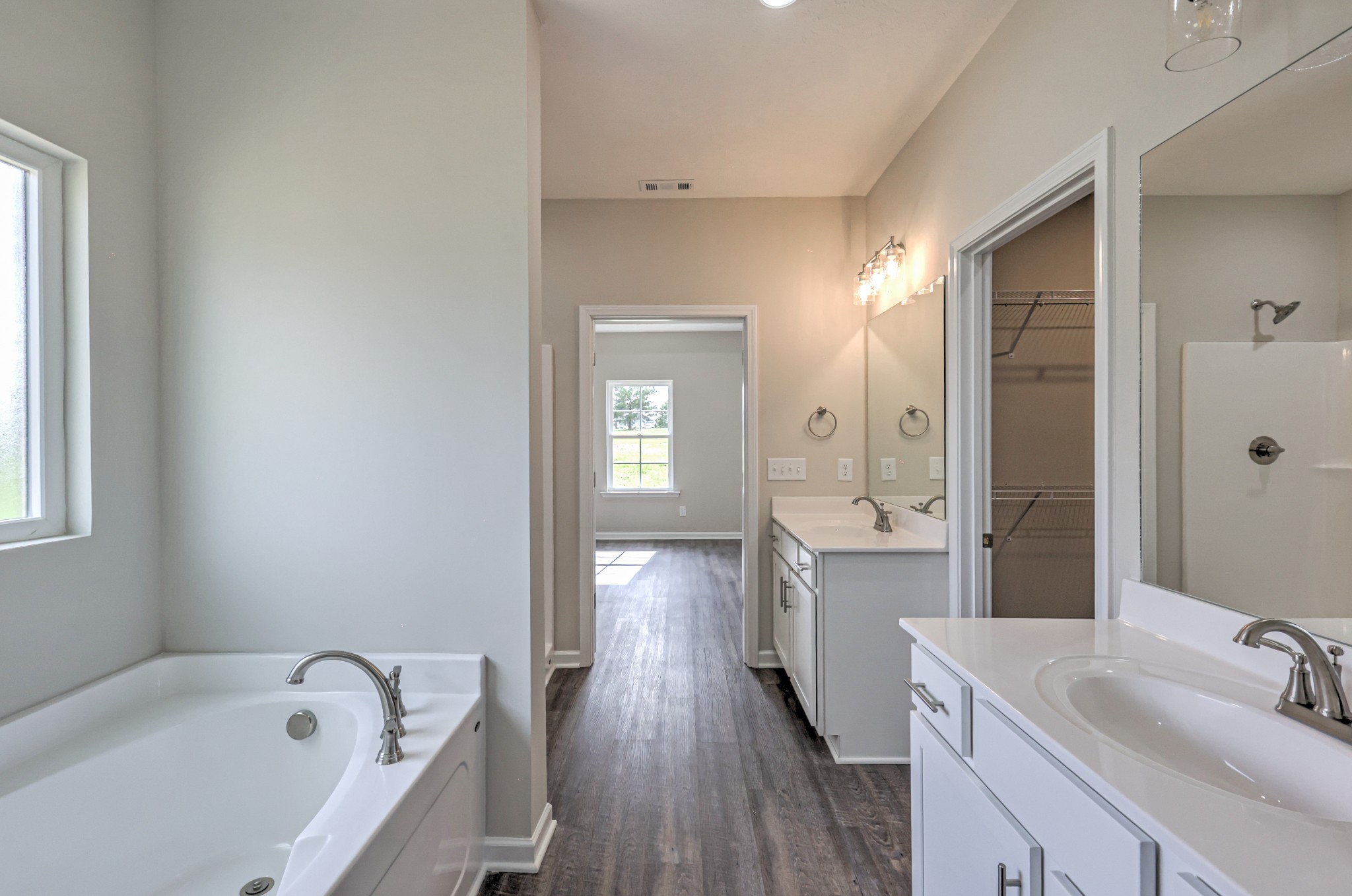 22 Bartow Street Decherd, TN 37324 - Photo 22 of 38 a bathroom with a bathtub a sink and a mirror