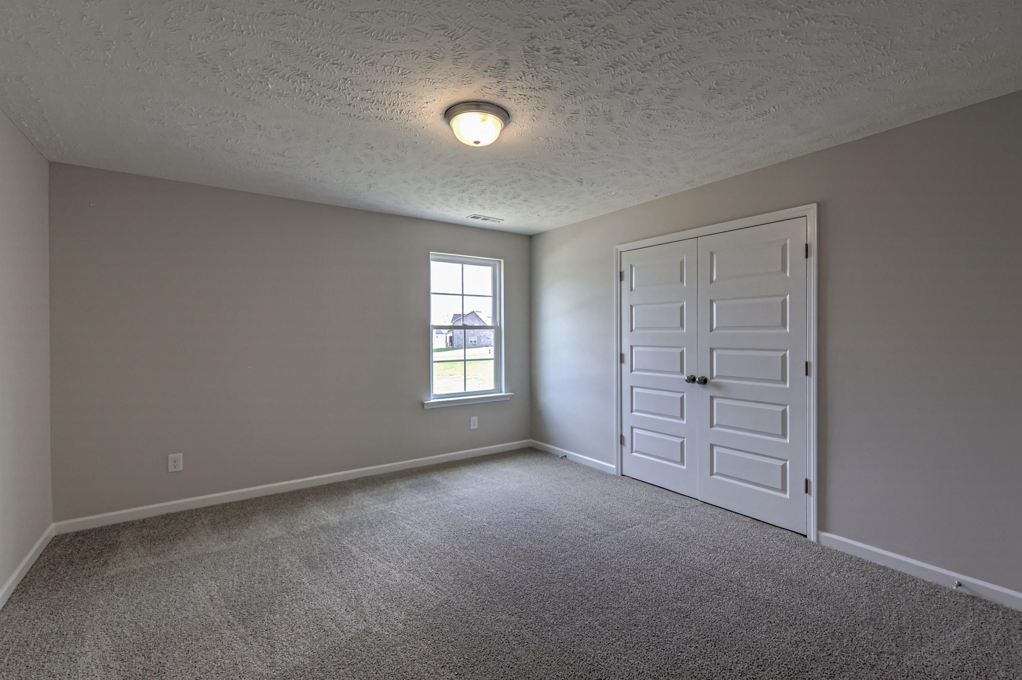 22 Bartow Street Decherd, TN 37324 - Photo 30 of 38 an empty room with windows and closet