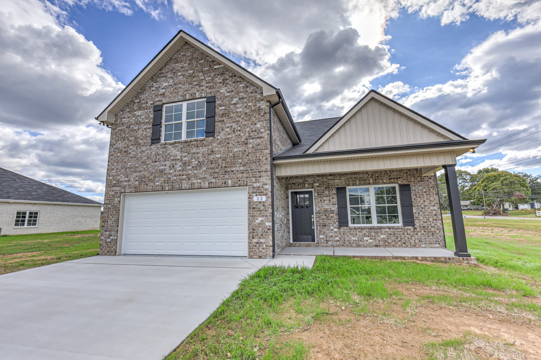 22 Bartow Street Decherd, TN 37324 - Photo 3 of 38 a front view of a house with garden