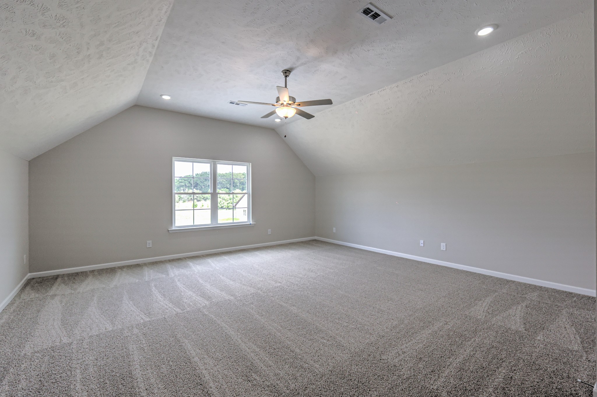22 Bartow Street Decherd, TN 37324 - Photo 32 of 38 an empty room with windows and ceiling fan