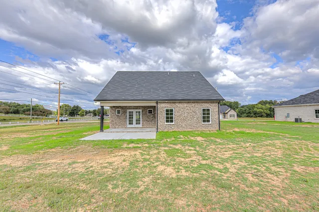 a front view of a house with a yard