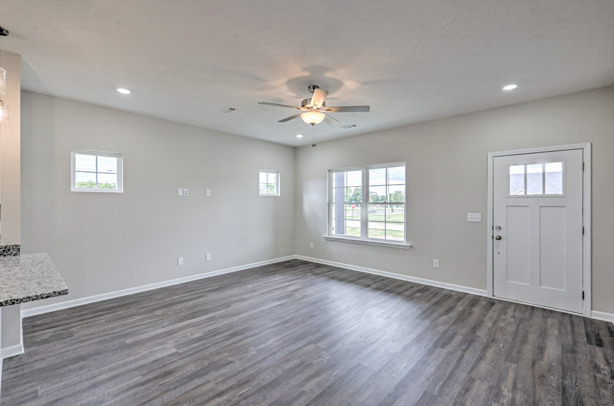 22 Bartow Street Decherd, TN 37324 - Photo 7 of 38 a view of an empty room with window and wooden floor