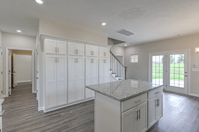 a view of a hallway with windows