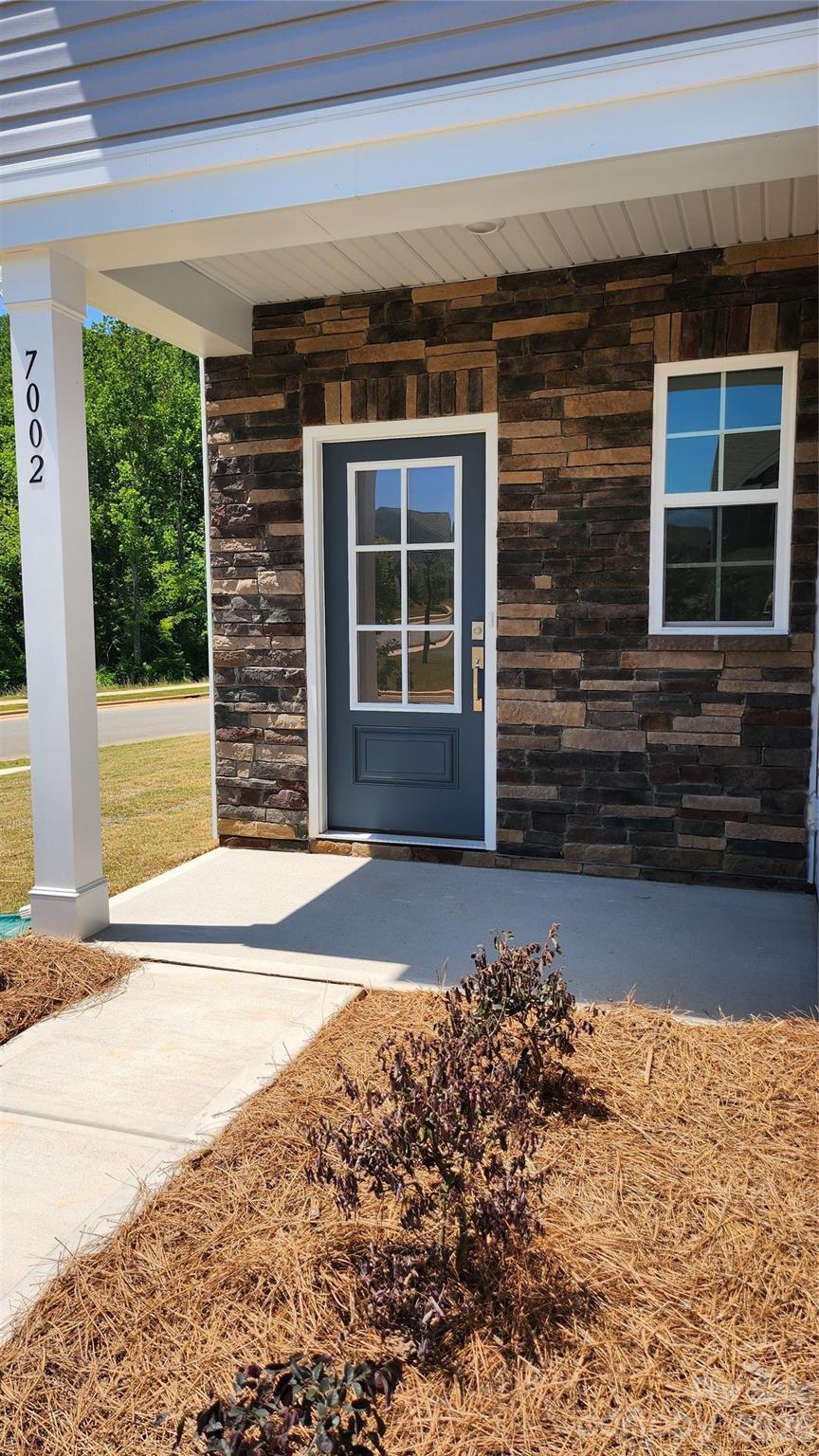 7002 Juneberry Way Maiden, NC 28650 - Photo 2 of 25 a front view of a house with a yard