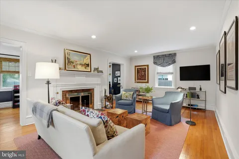 a bedroom with furniture and a large window