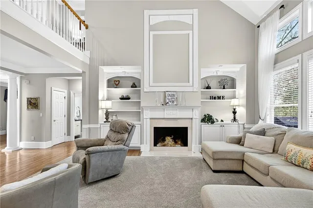a kitchen with kitchen island granite countertop a sink a counter top space and stainless steel appliances