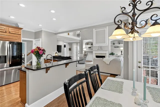 a kitchen with granite countertop a sink and a stove