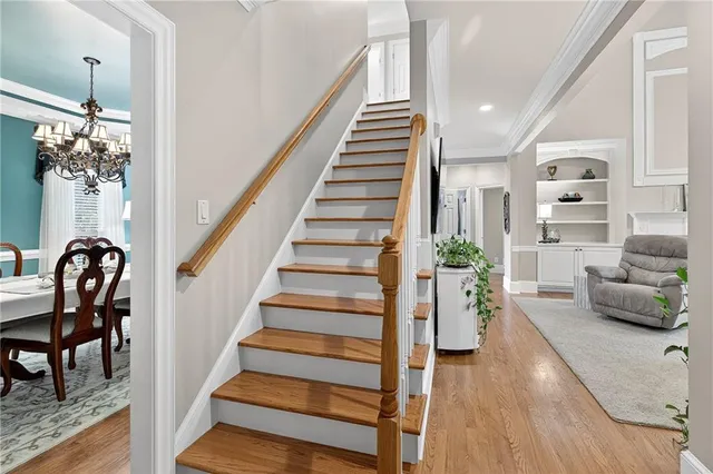 a bathroom with a tub a sink and a large mirror