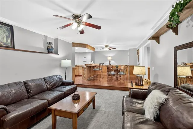 a view of a chairs and table in the roof deck