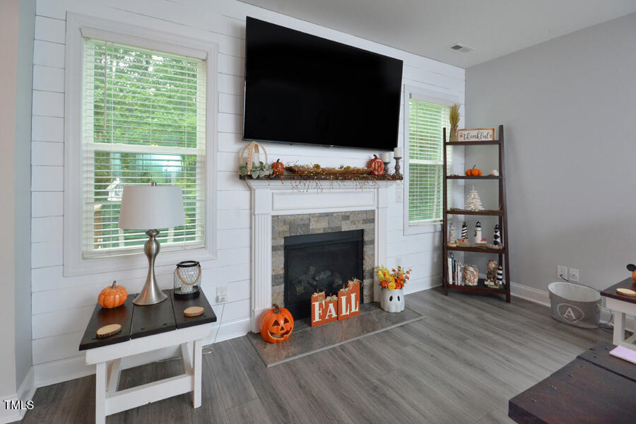 195 Timberwind Road Franklinton, NC 27525 - Photo 10 of 28 a living room with furniture and a flat screen tv