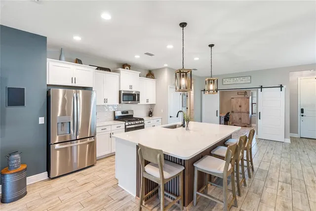 a view of living room filled with furniture and wooden floor