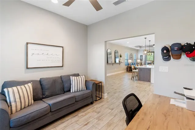 a bedroom with bed and wall painting