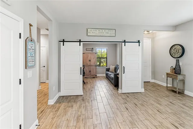 a bathroom with a sink a mirror and a shower curtain