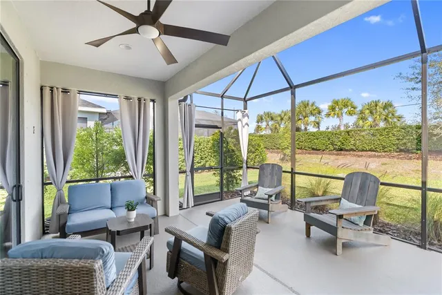 an aerial view of a house with garden space and swimming pool
