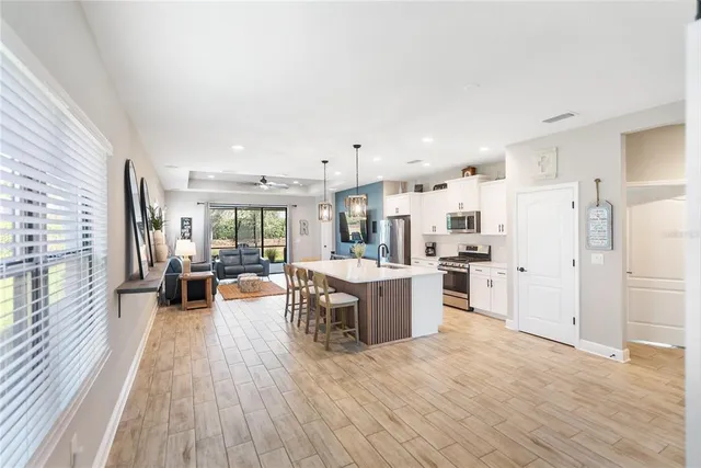 a view of living room with furniture and potted plant