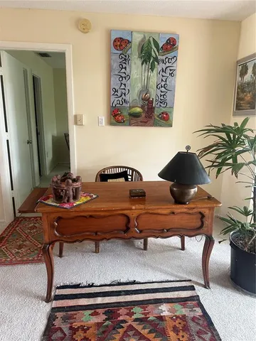 a living room with furniture and rug
