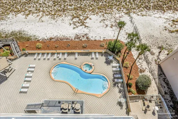 a view of a swimming pool with a lounge chair