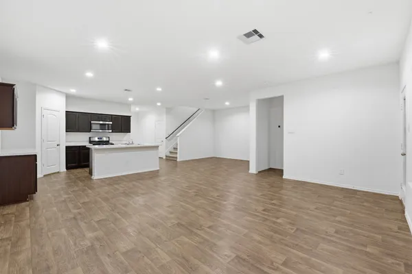 a view of a kitchen with microwave and cabinets