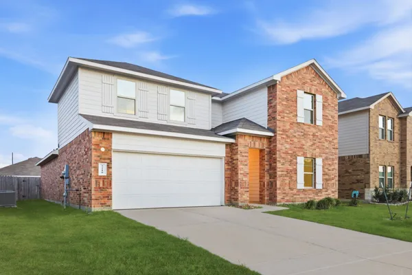 front view of a house with a yard