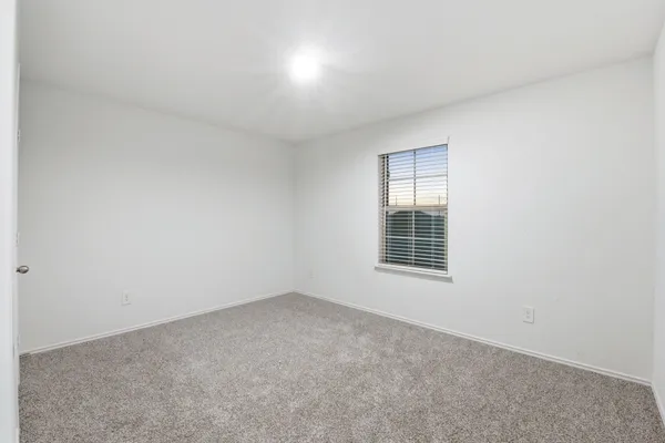 a view of a room that has a window in it