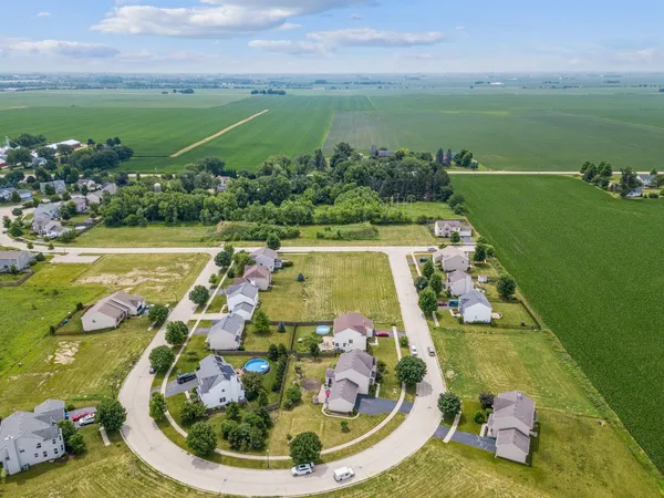 a view of a swimming pool with a yard