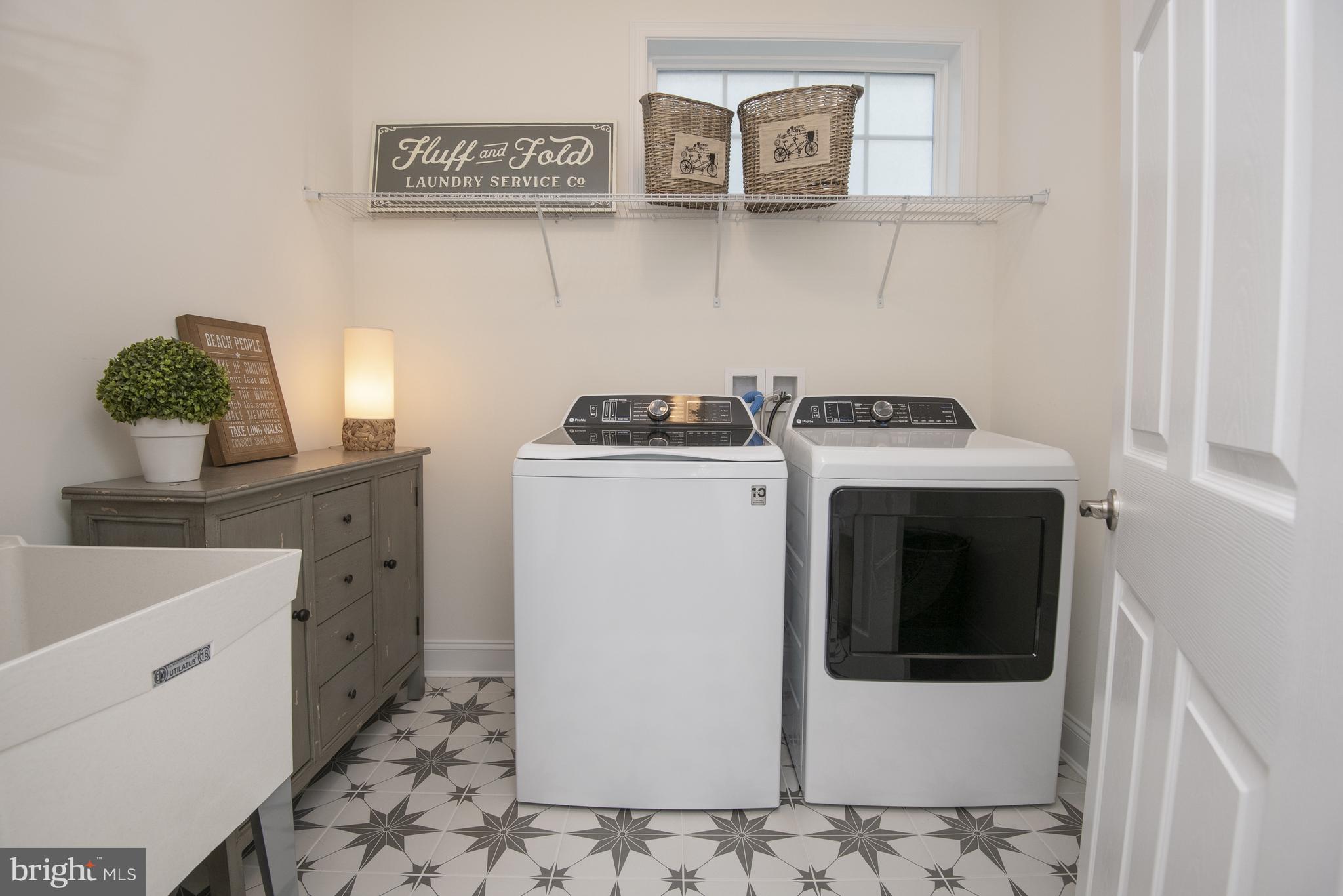 11313 Hall Road Lewes, DE 19958 - Photo 17 of 61 Laundry with sink and beautiful tile