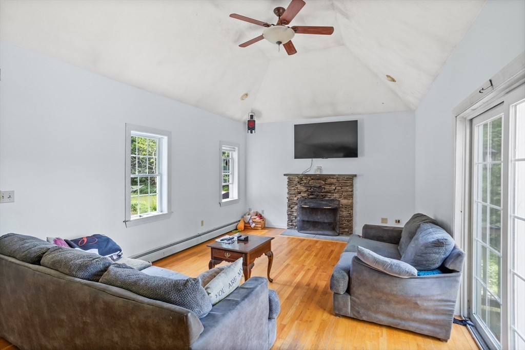 85 Wheeler Road Princeton, MA 01541 - Photo 7 of 28 a living room with furniture and a fireplace