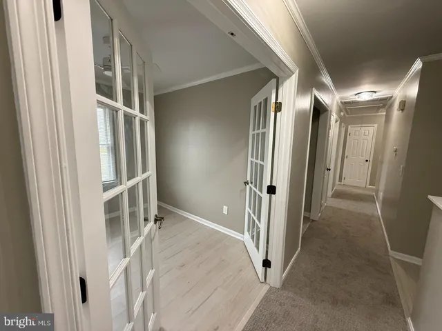 a view of entryway with wooden floor