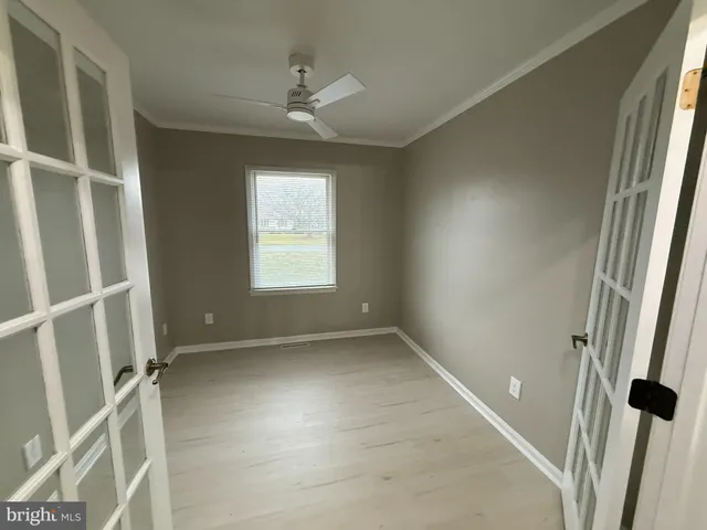 a view of an empty room with a window