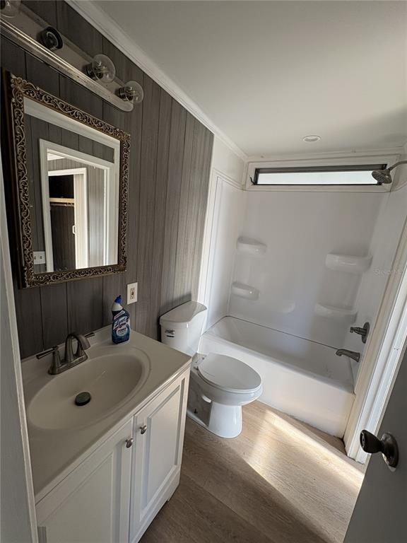 1183 9th Street Okeechobee, FL 34974 - Photo 4 of 14 a bathroom with a sink a toilet and shower