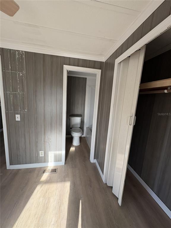 1183 9th Street Okeechobee, FL 34974 - Photo 6 of 14 a view of a room with wooden floor and a bathroom