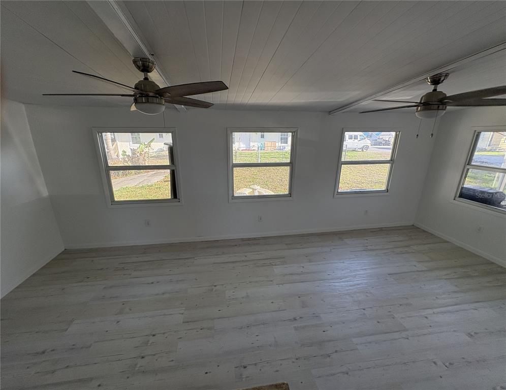 1183 9th Street Okeechobee, FL 34974 - Photo 9 of 14 a view of an empty room with a window