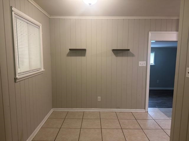 1406 Sycamore Road Collierville, TN 38017 - Photo 3 of 6 Spare room with baseboards, wood walls, and light tile patterned floors