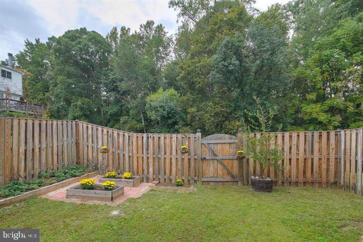 8416 Cedar Falls Court Springfield, VA 22153 - Photo 2 of 31 a backyard of a house with table and chairs