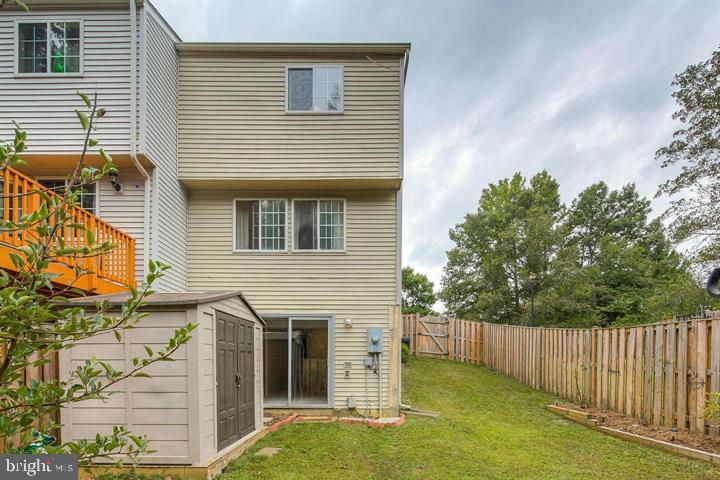 8416 Cedar Falls Court Springfield, VA 22153 - Photo 3 of 31 a view of a house with a yard and wooden fence