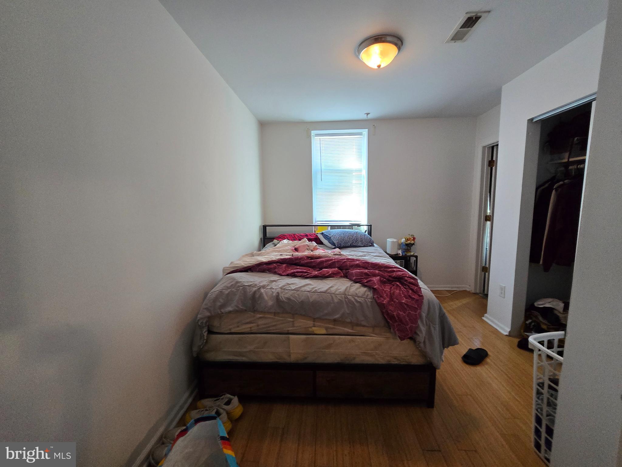 1833 Master Street Philadelphia, PA 19121 - Photo 6 of 22 a bedroom with a bed and window