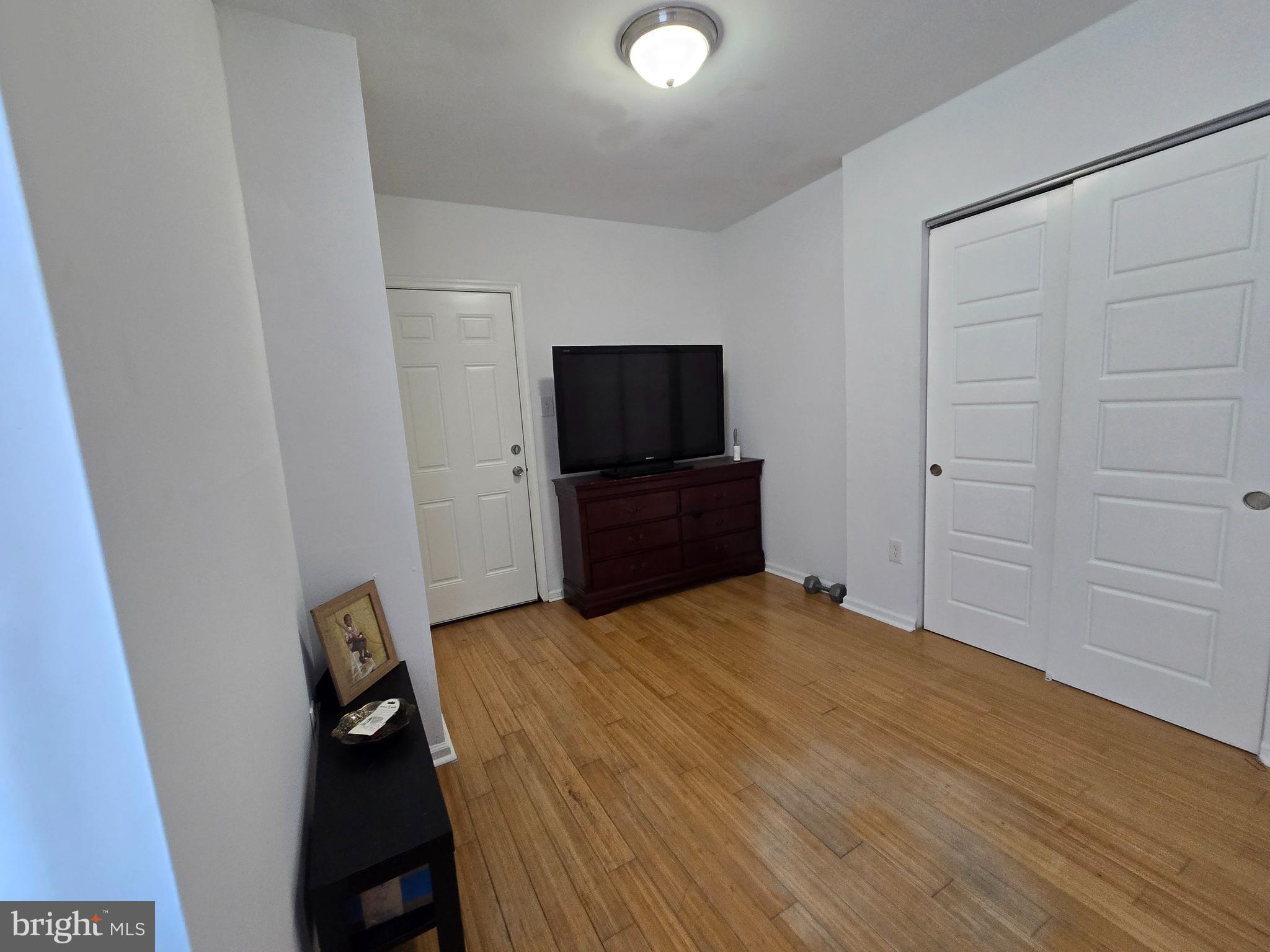 1833 Master Street Philadelphia, PA 19121 - Photo 8 of 22 a bedroom with a bed and a flat screen tv